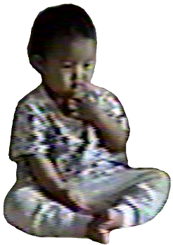 fuzzy pixelated image of sohyeon as a child, taken from a home video, probably in 1998 or so. she looks like a little lumpy potato and is sitting on a couch, watching the television.